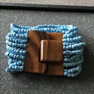 Multi strand beads bracelet with wood clasp